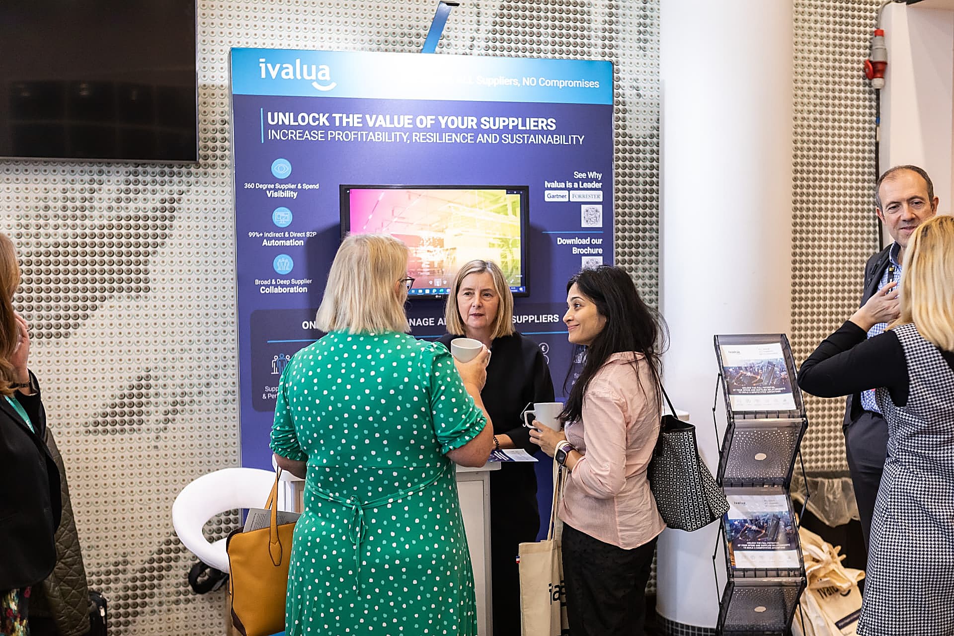 A sponsor talking with a delegate at a partner stand